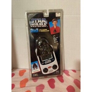STAR WARS 2 in 1 LCD Game Plus Vader Medallion MGA 1996-Never opened READ DESC